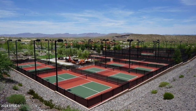 view of basketball court featuring a mountain view and tennis court