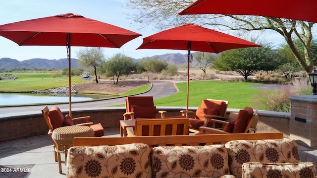 view of patio with outdoor lounge area and a water and mountain view