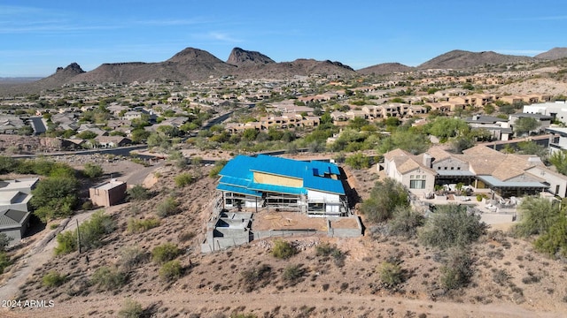 birds eye view of property featuring a mountain view