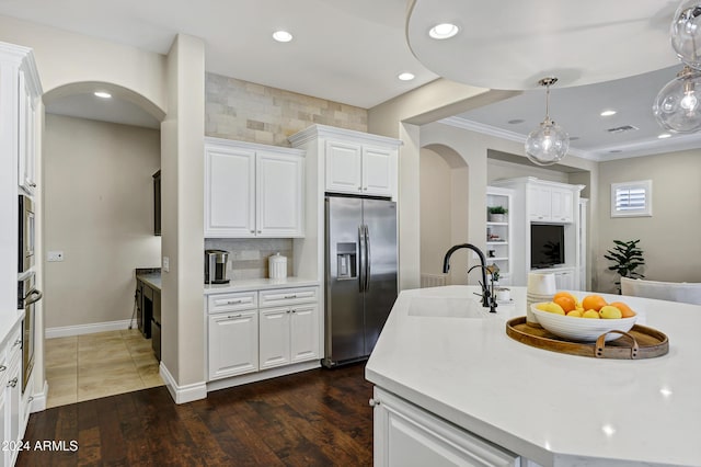 kitchen featuring white cabinets, appliances with stainless steel finishes, dark hardwood / wood-style flooring, and sink