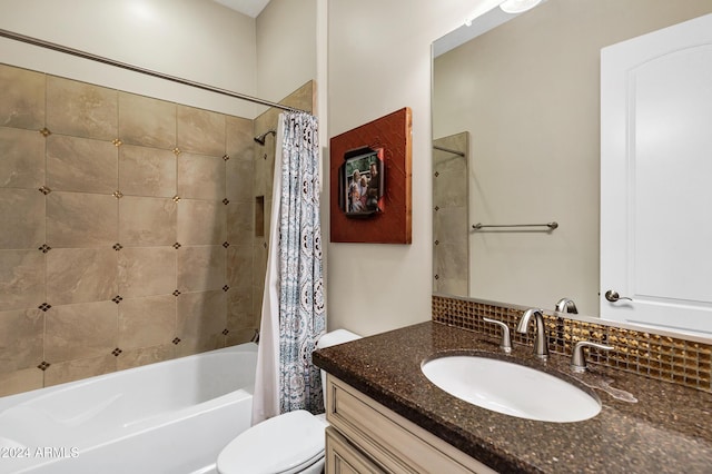 full bathroom with shower / bath combination with curtain, toilet, and vanity