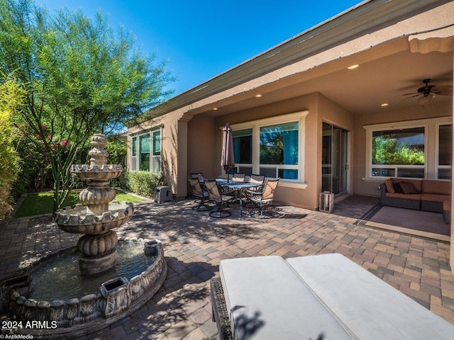 view of patio / terrace featuring ceiling fan