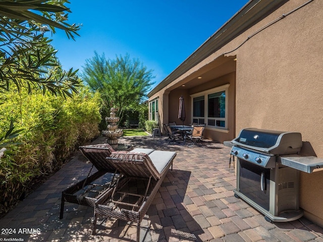 view of patio with a grill