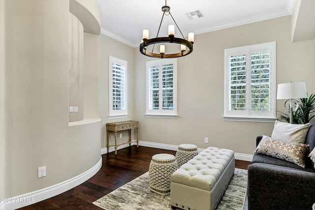 interior space featuring dark hardwood / wood-style flooring, ornamental molding, and an inviting chandelier