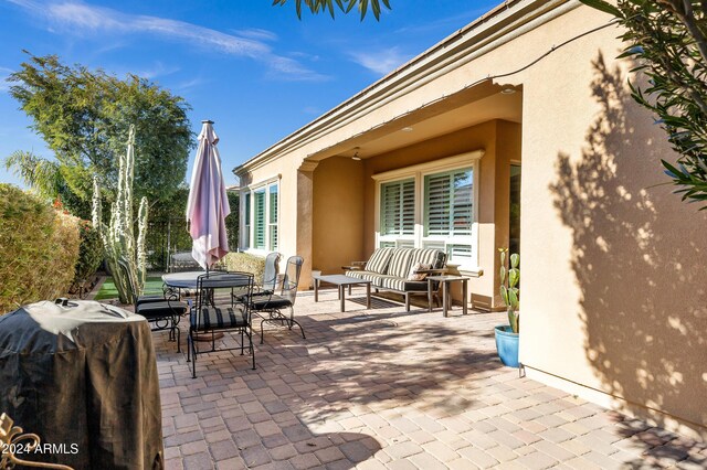 view of patio with an outdoor living space and area for grilling