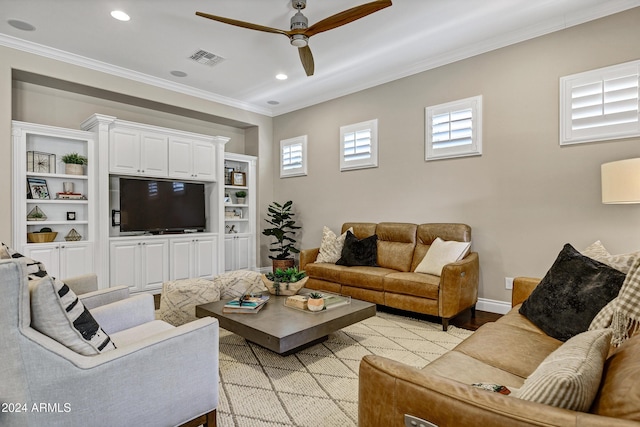 living room featuring crown molding, light hardwood / wood-style flooring, and ceiling fan