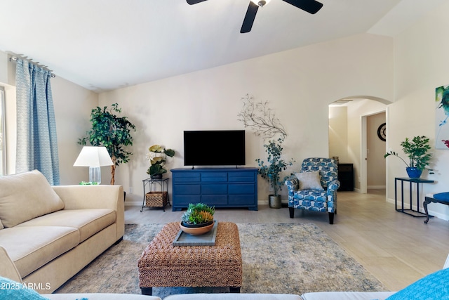 living room with vaulted ceiling and ceiling fan