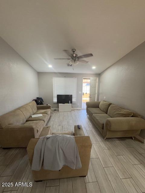 living room featuring ceiling fan