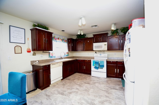 kitchen with white appliances and sink