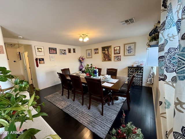 dining space featuring dark hardwood / wood-style flooring