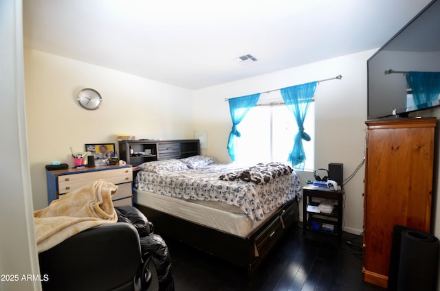 bedroom featuring dark hardwood / wood-style floors