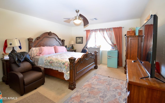 bedroom featuring light colored carpet and ceiling fan