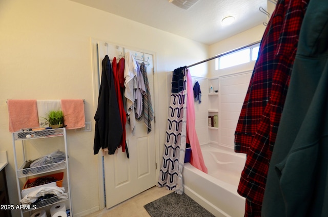 bathroom with shower / bath combination with curtain