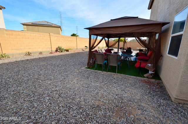 view of yard featuring a gazebo and a patio