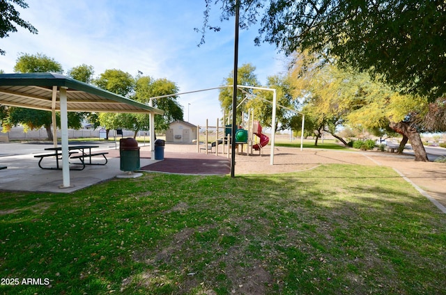 view of home's community featuring a yard and a playground