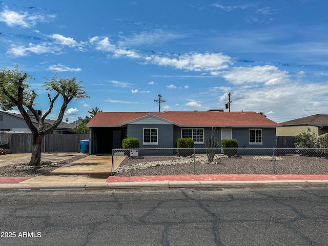 2928 N 37th Ave, Phoenix, AZ 85019 - single story home featuring a fenced front yard and driveway