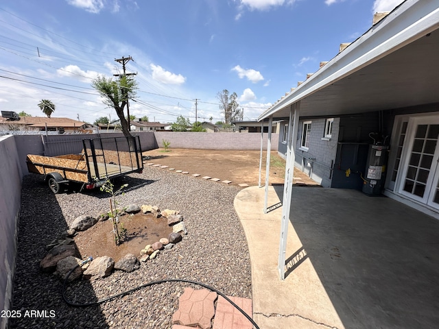 2928 N 37th Ave, Phoenix, AZ 85019 - fenced backyard featuring electric water heater and a patio area
