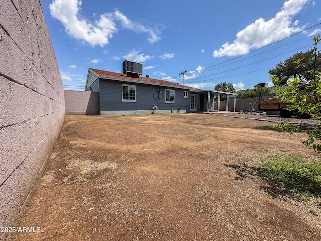 2928 N 37th Ave, Phoenix, AZ 85019 - back of property featuring central AC unit and fence