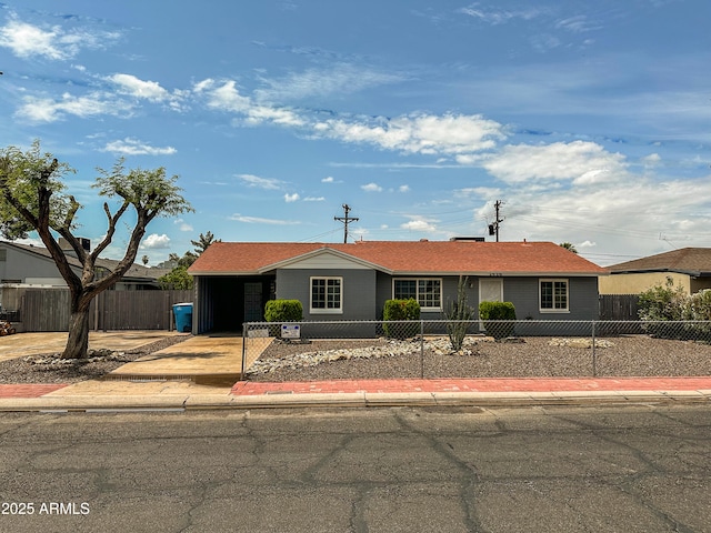 2928 N 37th Ave, Phoenix, AZ 85019 - ranch-style house with a fenced front yard and driveway