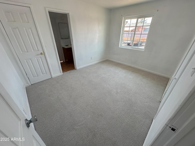 2928 N 37th Ave, Phoenix, AZ 85019 - unfurnished bedroom featuring carpet floors and baseboards