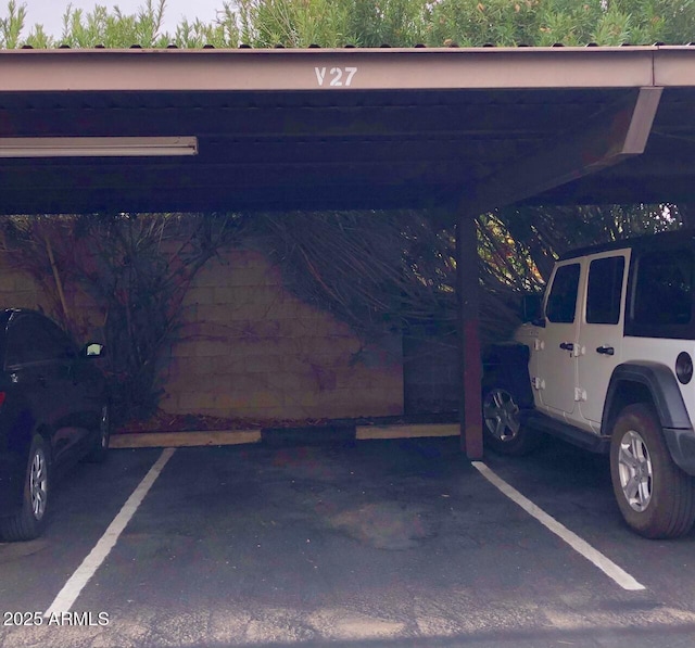 garage featuring covered parking