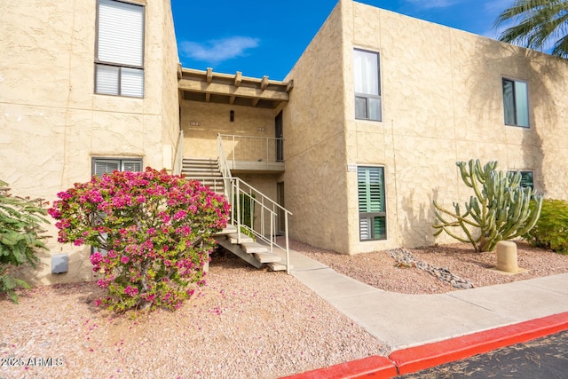 view of property featuring stairway