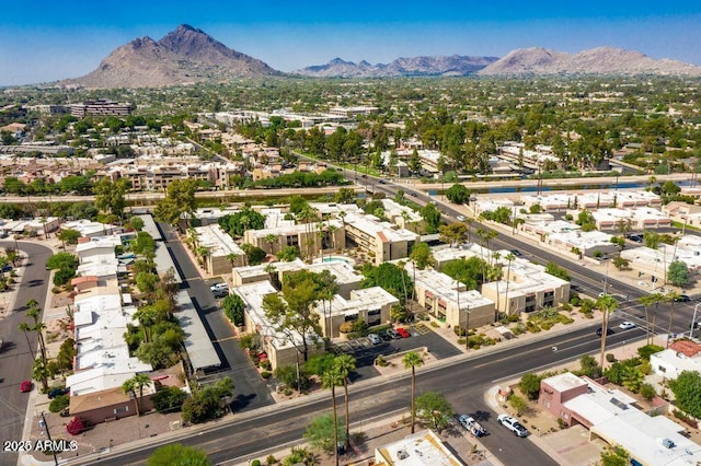 birds eye view of property with a mountain view