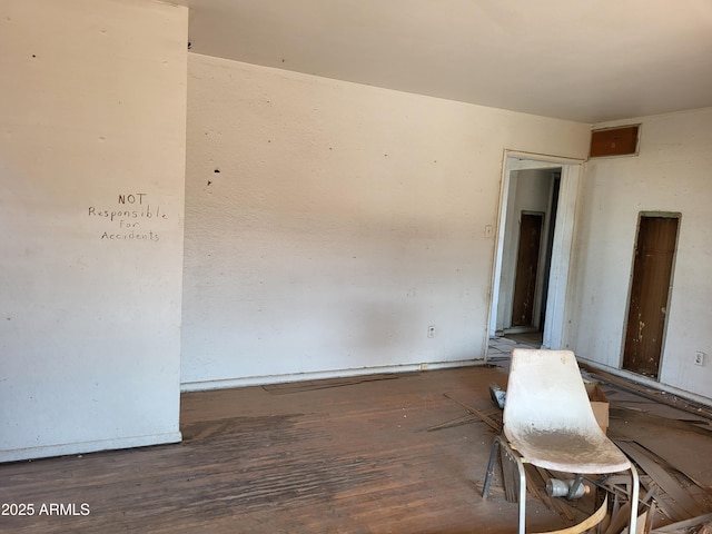 empty room featuring wood-type flooring