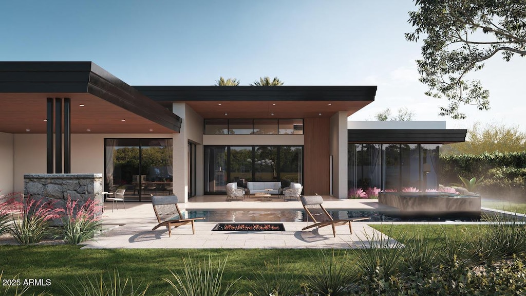 back of house featuring an outdoor living space with a fire pit, a patio, stucco siding, a lawn, and a jacuzzi