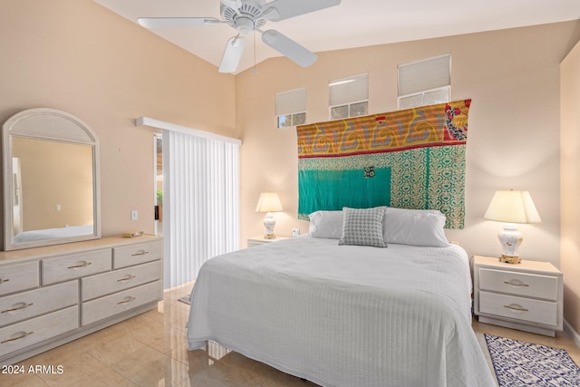 bedroom featuring vaulted ceiling, light tile patterned flooring, and ceiling fan