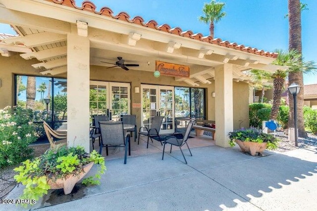 view of patio featuring ceiling fan