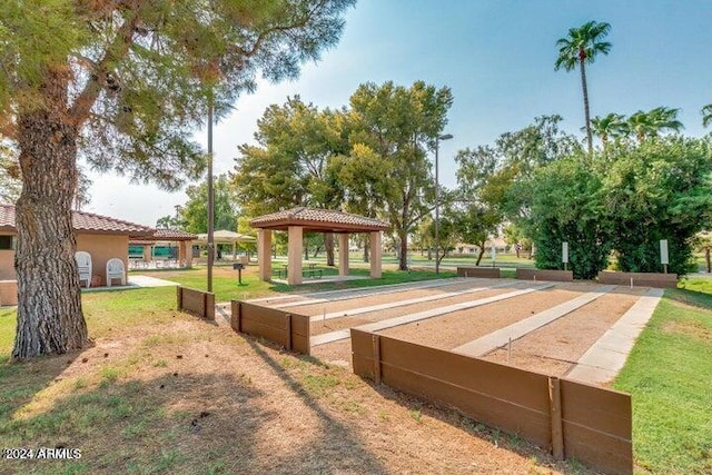 view of property's community with a gazebo and a yard