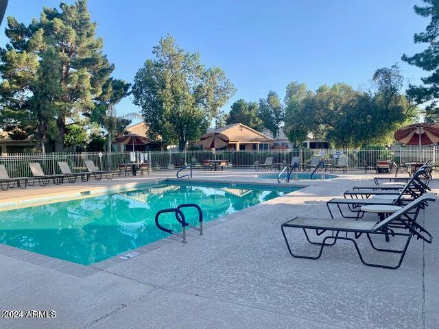 view of swimming pool featuring a patio area