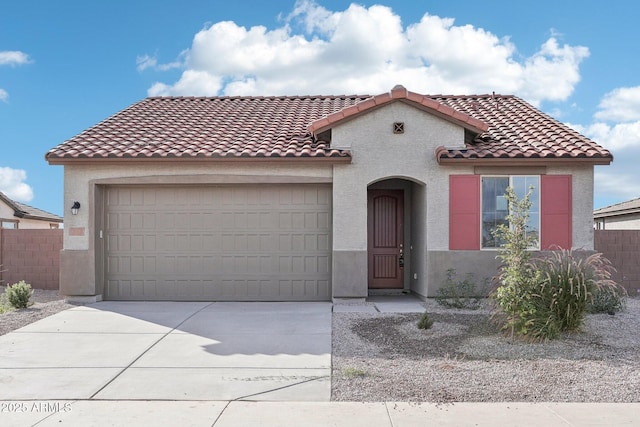 15611 W Hackamore Dr, Surprise, AZ 85387 - mediterranean / spanish-style home with concrete driveway, stucco siding, a garage, and a tiled roof