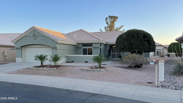 view of front of property with a garage