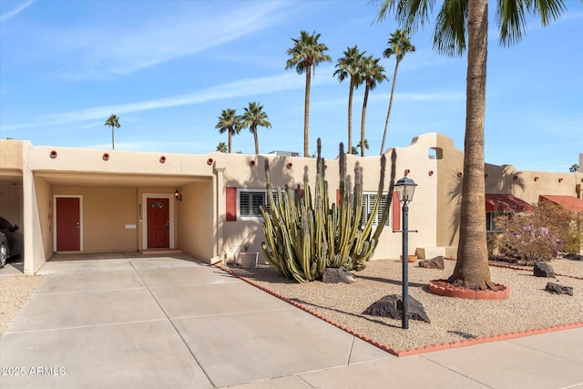 southwest-style home featuring a carport