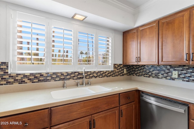 kitchen with sink, decorative backsplash, ornamental molding, and dishwasher