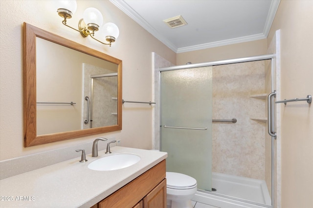 bathroom with vanity, crown molding, a shower with door, and toilet