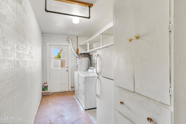 laundry room with washing machine and dryer and water heater