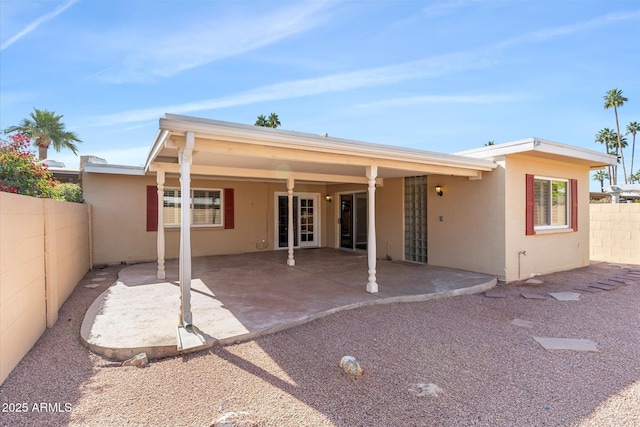 back of property with a patio area