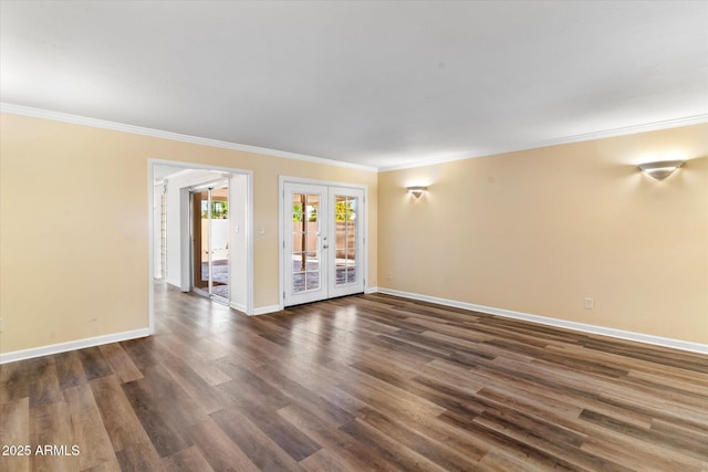 spare room featuring ornamental molding, dark hardwood / wood-style flooring, and french doors