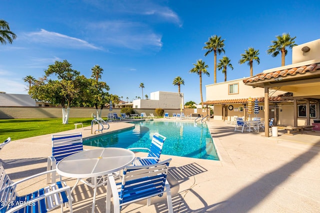 view of swimming pool featuring a patio area