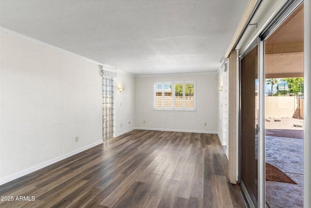 unfurnished room with dark hardwood / wood-style flooring and ornamental molding