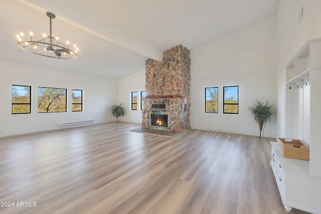 unfurnished living room with high vaulted ceiling, a stone fireplace, beam ceiling, wood-type flooring, and a chandelier