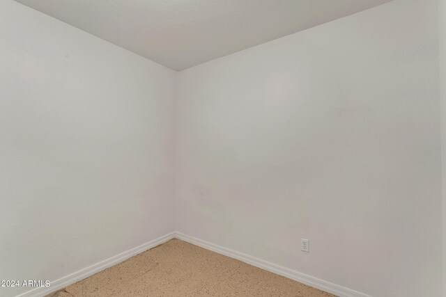 empty room with baseboards