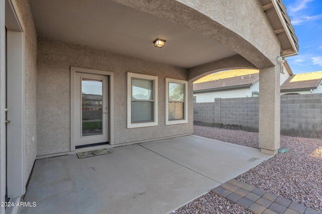 view of patio / terrace featuring fence