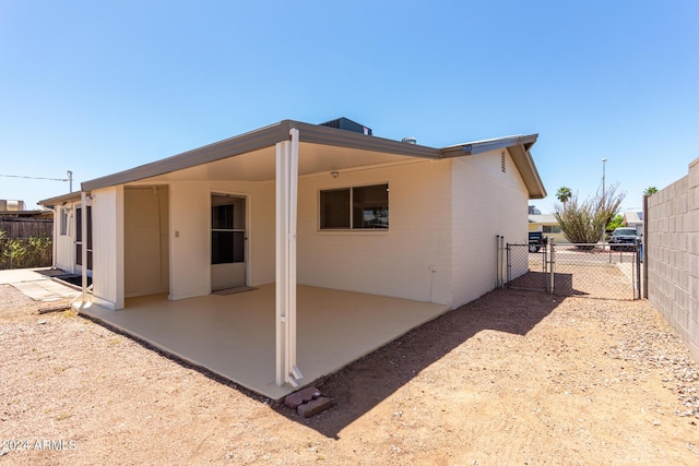 rear view of property with a patio area