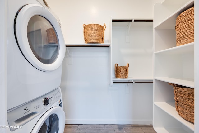 7854 W Tether Trl, Peoria, AZ 85383 - laundry area featuring estacked washer and dryer, wood finished floors, and baseboards