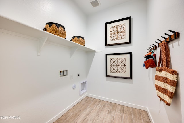 7854 W Tether Trl, Peoria, AZ 85383 - laundry room featuring hookup for an electric dryer, hookup for a gas dryer, light wood finished floors, baseboards, and washer hookup