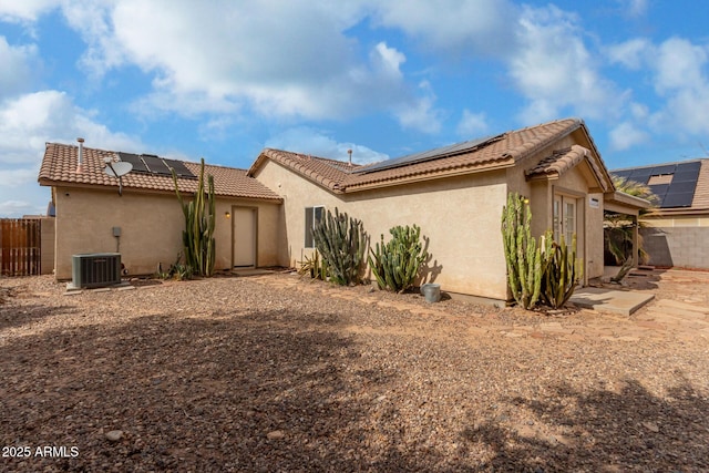 1625 E Clover St, Casa Grande, AZ 85122 - rear view of property featuring solar panels, stucco siding, and a tiled roof